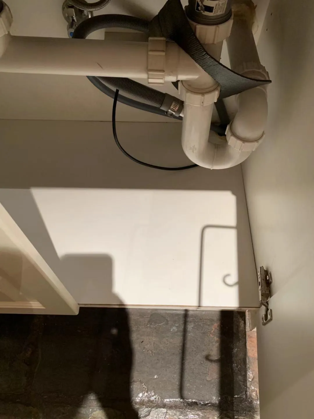 Under sink cabinet after cleaning