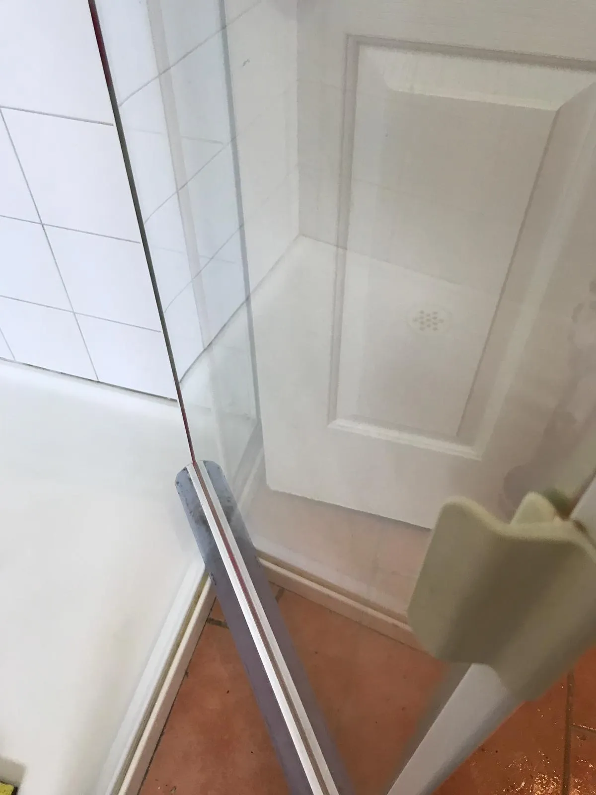 Shower door with bathtub after cleaning