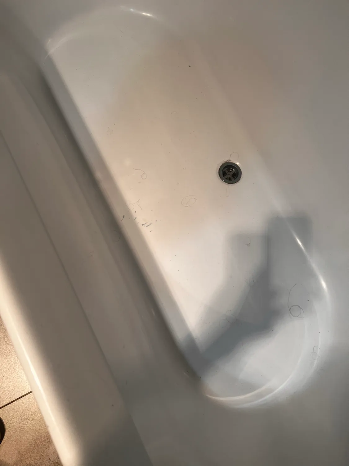 Laundry tub with stains before cleaning