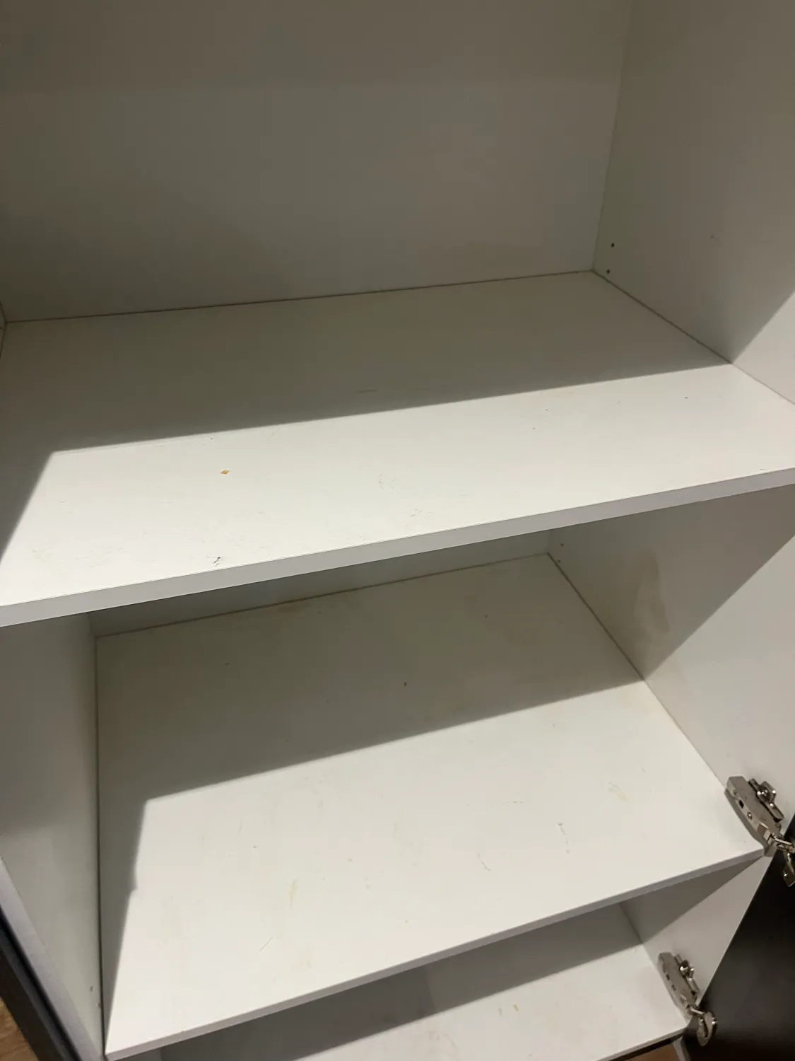 Cupboard interior white before cleaning