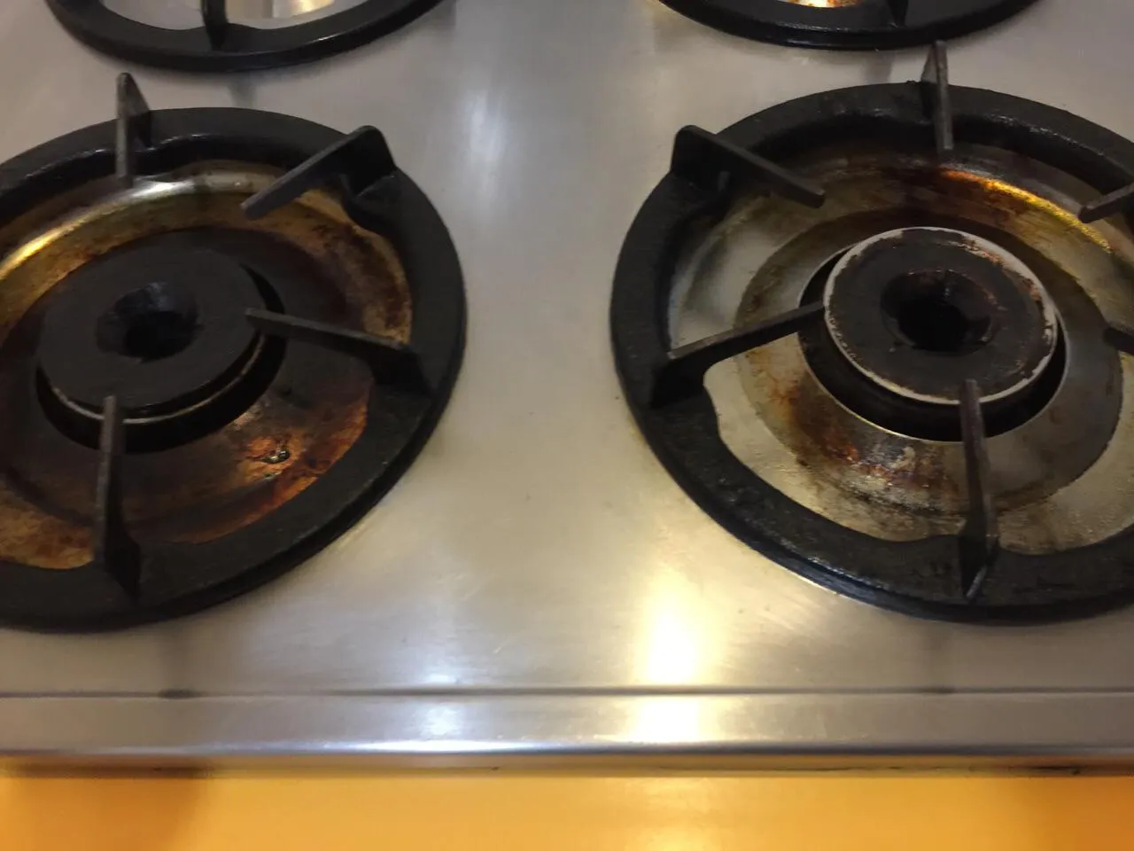 Cooktop burners rusty before cleaning