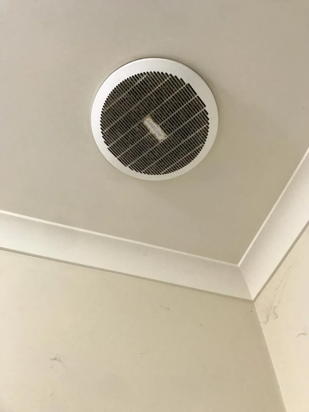 Ceiling exhaust fan before cleaning