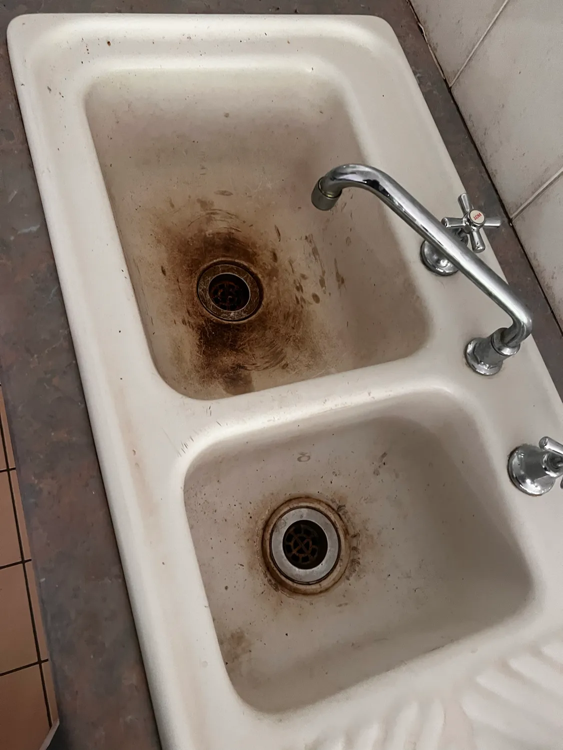 Dirty laundry sink before cleaning