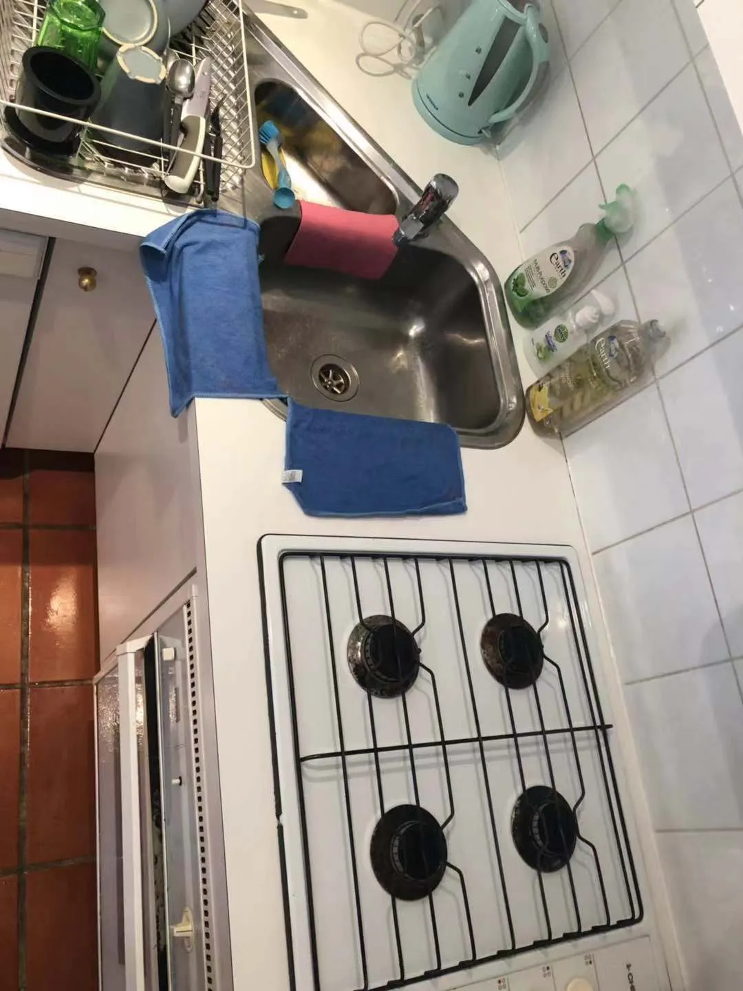 Kitchen cooktop and sink before cleaning