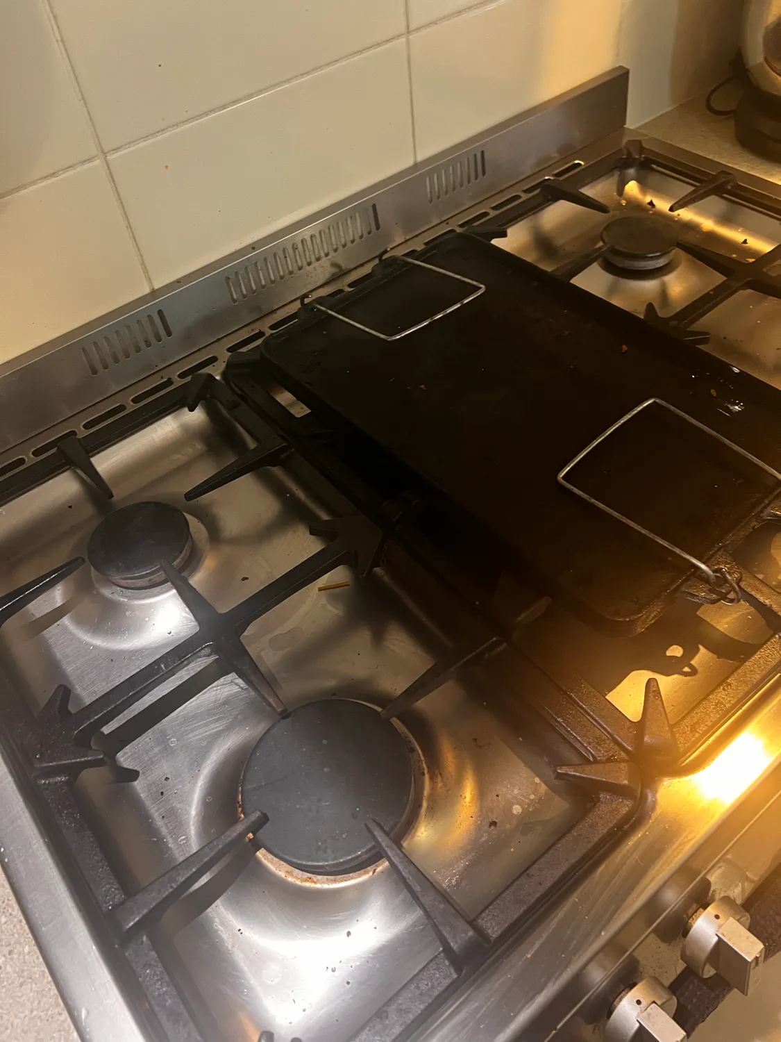 Gas stovetop before cleaning