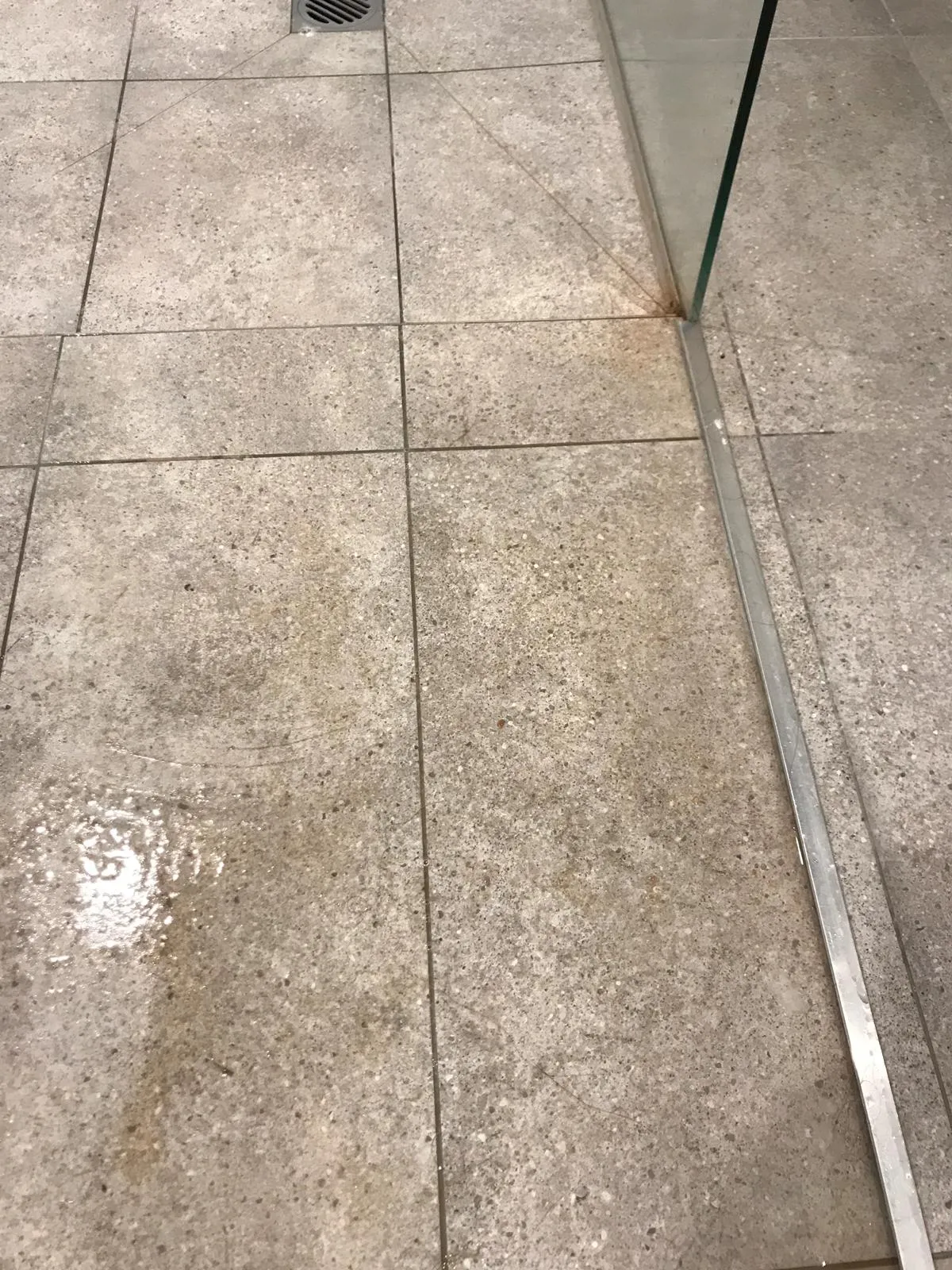 Bathroom floor tiles before cleaning