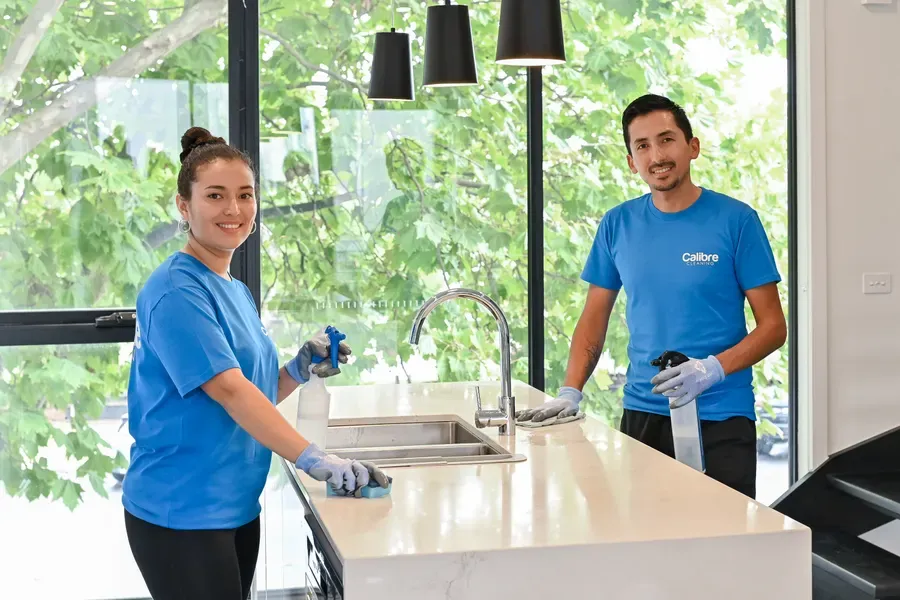 The Calibre Cleaning team in a Melbourne kitchen