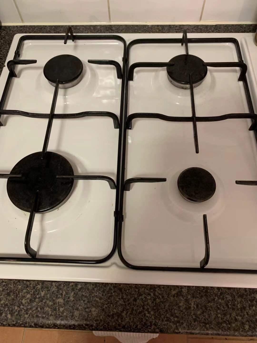 Gas stovetop pristine and degreased after professional kitchen cleaning